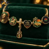 Reggae inspired gold charm bracelet featuring Bob Marley and One Love charms