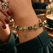 Gold charm bracelet featuring Bob Marley and Reggae-themed charms.