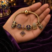 Gold charm bracelet with religious and skull motifs from Tvpcomebackshop