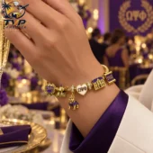 Omega Psi Phi 1911 Gold Charm Bracelet Set 2026 1 Omega Psi Phi charm bracelet featuring purple and gold symbols