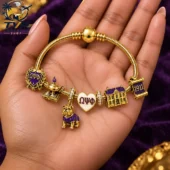 Omega Psi Phi 1911 Gold Charm Bracelet Set 2026 3 Omega Psi Phi gold charm bracelet with fraternity-themed jewelry pieces