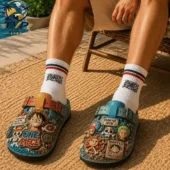 One Piece Straw Hat Pirates 3D Embossed Suede Clogs 2 A person wearing One Piece themed clog shoes and matching character socks from Tvpcomebackshop.