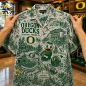 Oregon Ducks Mighty Oregon 3D Hawaiian Shirt 2 Person holding an Oregon Ducks themed button-down shirt with a tropical forest print featuring stadium and mascot illustrations.