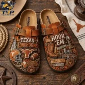 Pair of custom Texas Longhorns branded cork-soled sandals on wooden background