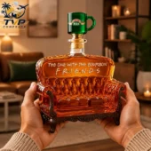 Friends themed bourbon decanter shaped like a sofa with Central Perk coffee mug stopper